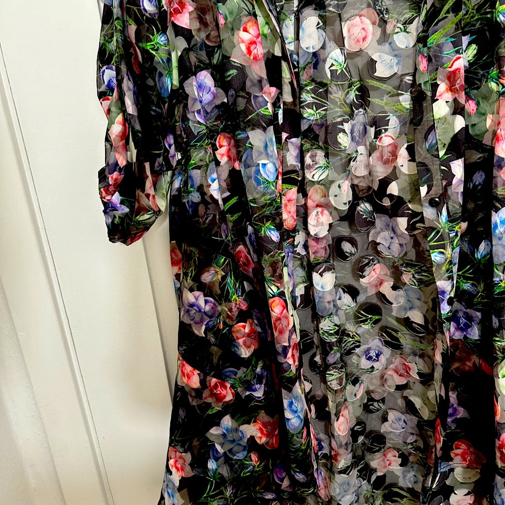 Dress/coat for layering with pockets. Fits a size small and medium